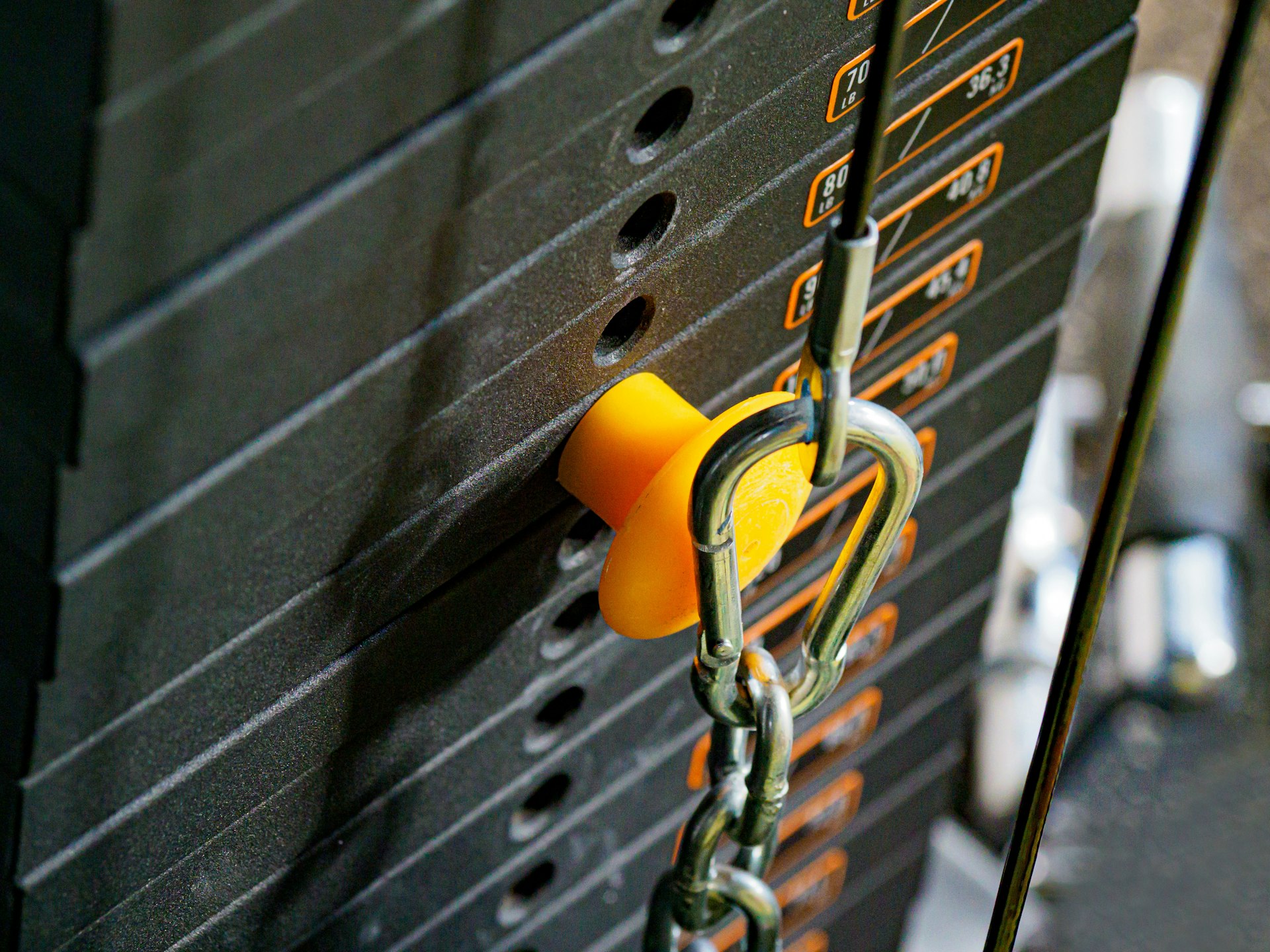 yellow padlock on black metal door